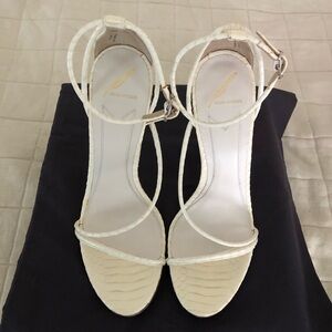Brian Atwood off white snake skin sandals.